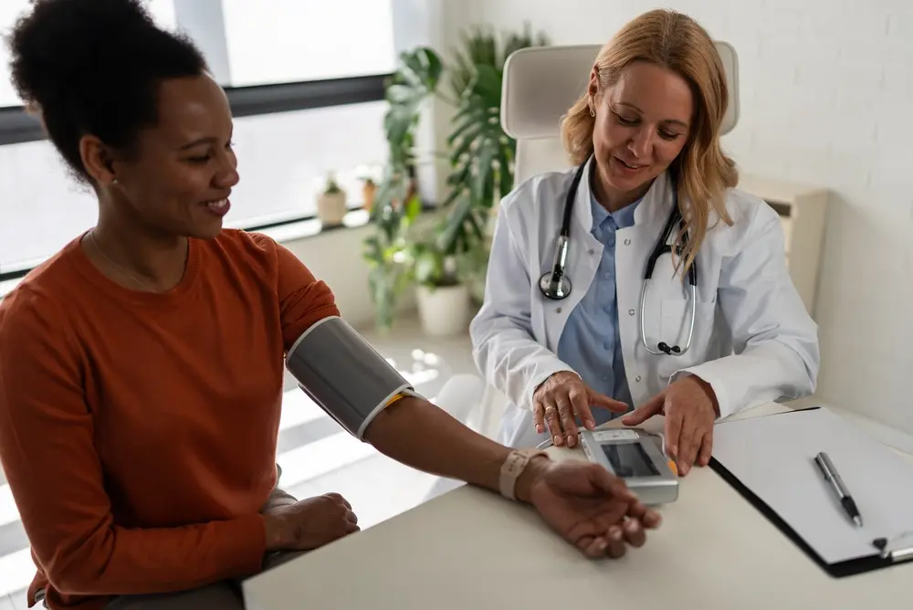Female doctor discussing chronic care for Palm Beach County residents