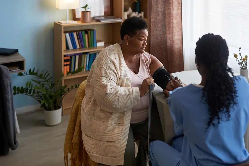 Female doctor discussing chronic care coordination with a male patient