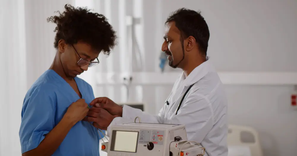 Female doctor consulting a man during an EMC visit