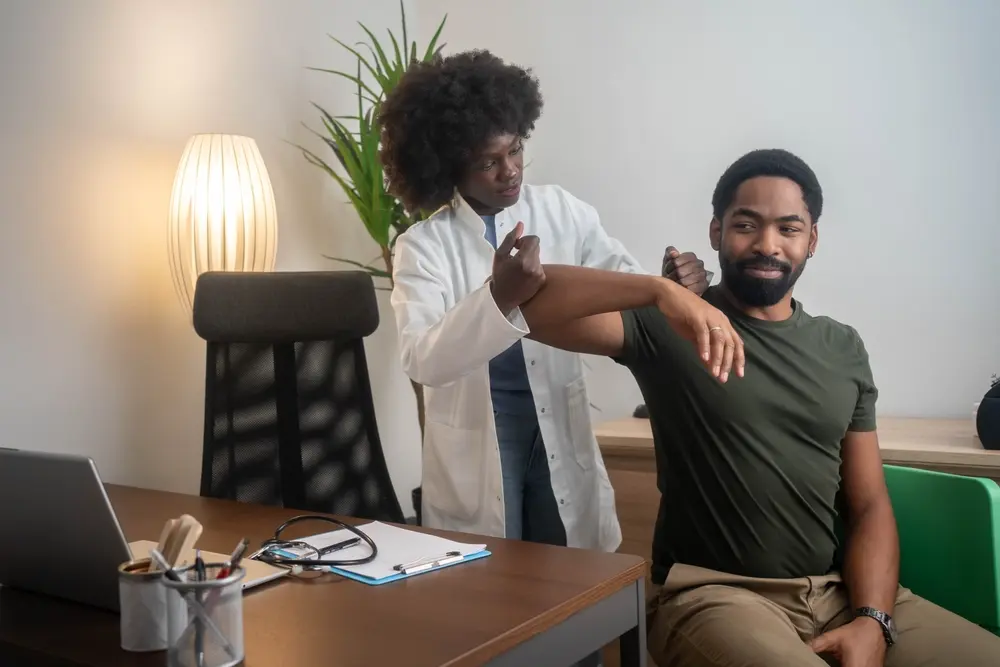 Doctor discussing mobility support with a male patient