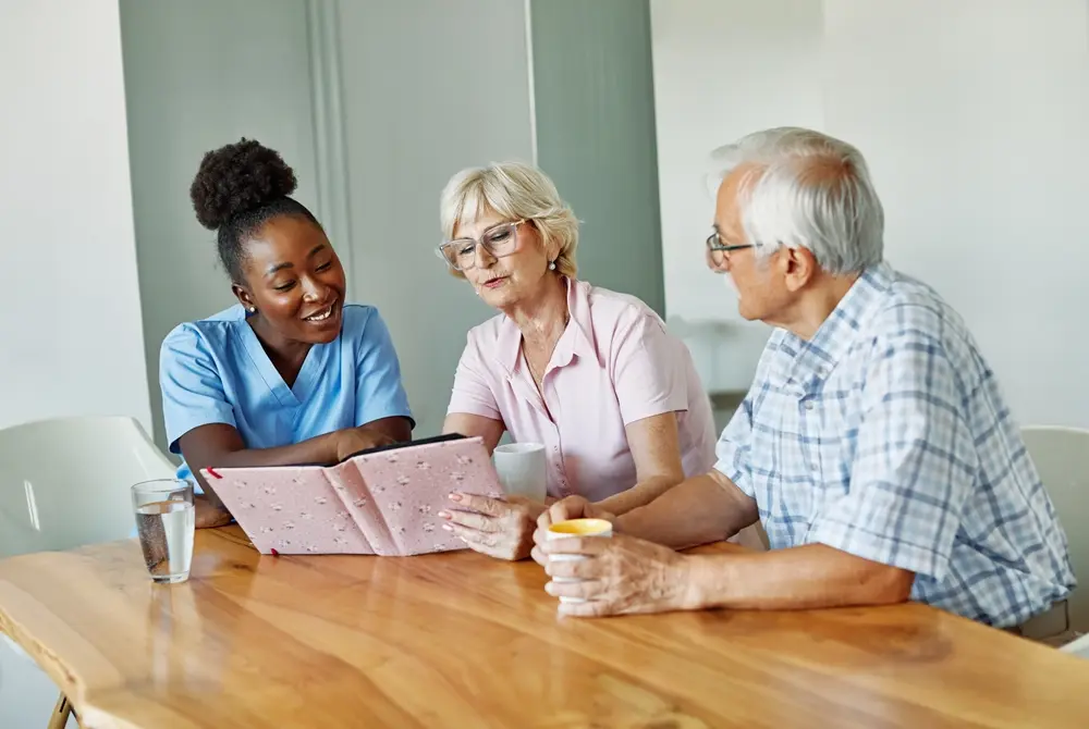 Female doctor reviewing senior health concerns with a male patient