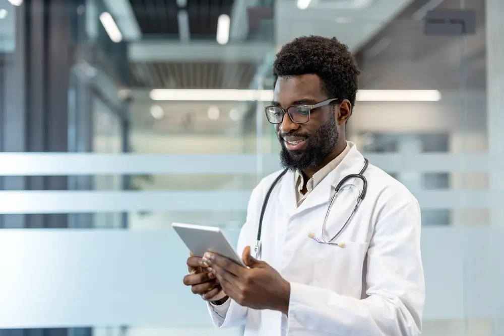 Happy couple consulting with a doctor about flexible healthcare access options