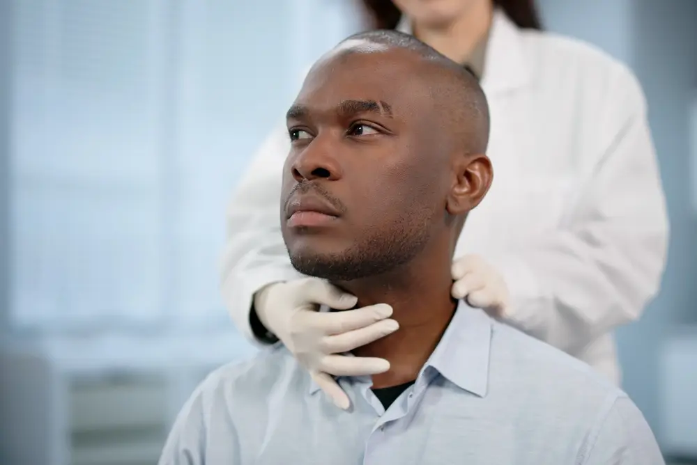 Female doctor discussing immigration physical exam requirements with a male patient