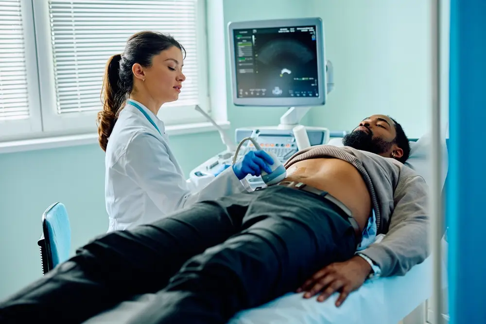 Female doctor discussing adult medical care with a male patient