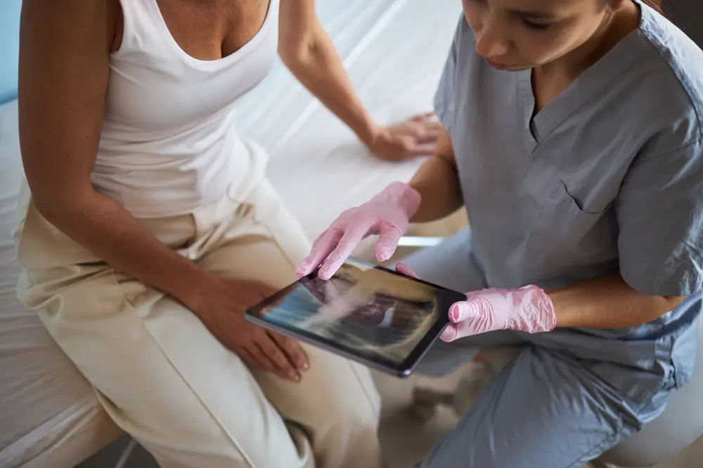 Male doctor measuring a patient’s blood pressure during a routine health exam