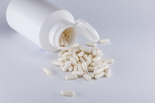 White container with spilled pills for opioid addiction treatment