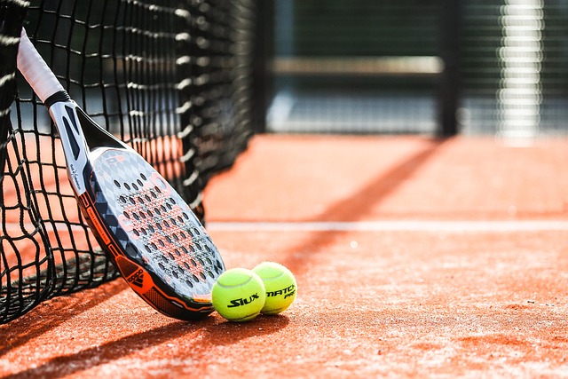 Paddle racket and two balls on a court for school sports physical requirements