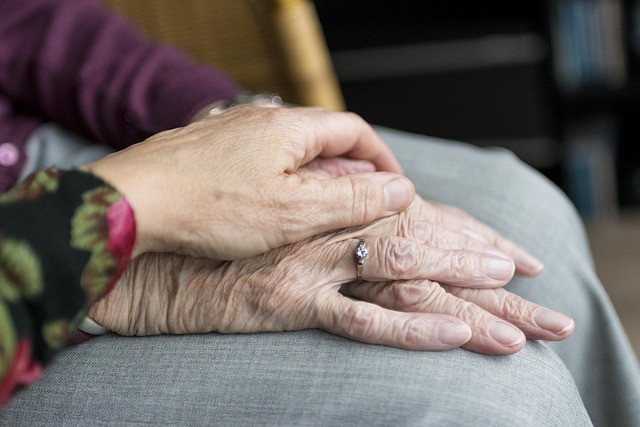 Elderly couple holding hands during routine family health checkups