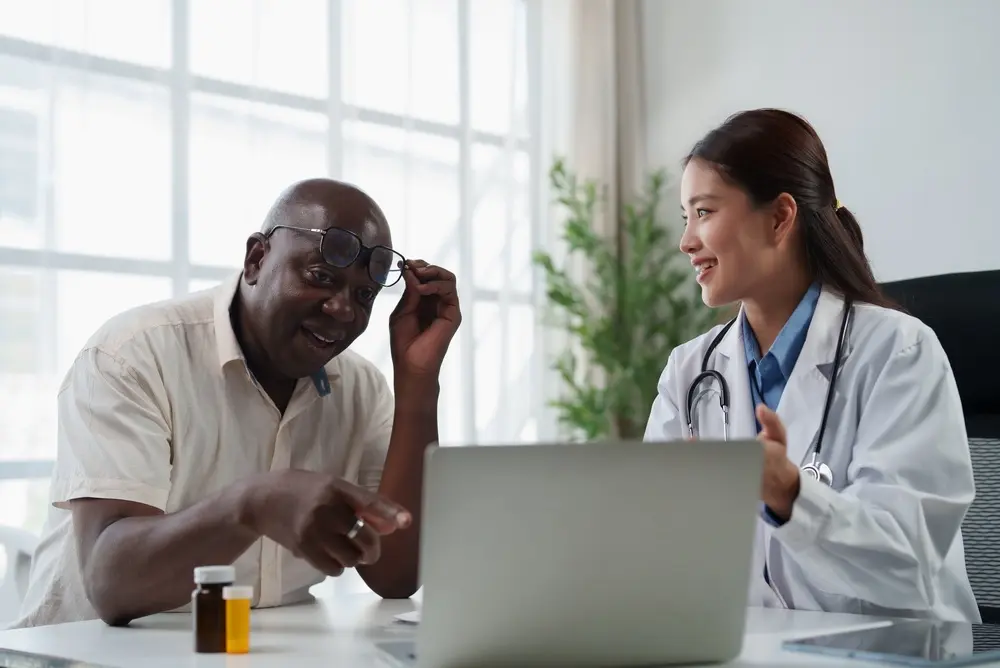 Female doctor discussing addiction recovery care with a male patient