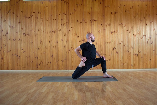 Man practicing yoga as part of men’s health screening wellness